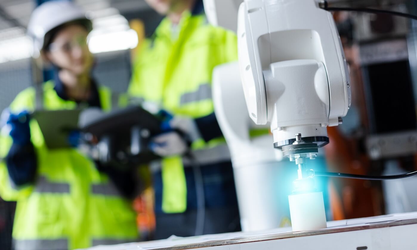 Robotic arm operating in a smart factory environment Robotic arm operating in a smart factory environment